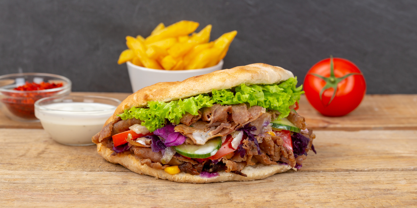 DÃ¶ner Kebab Doner Kebap fast food in flatbread with fries o