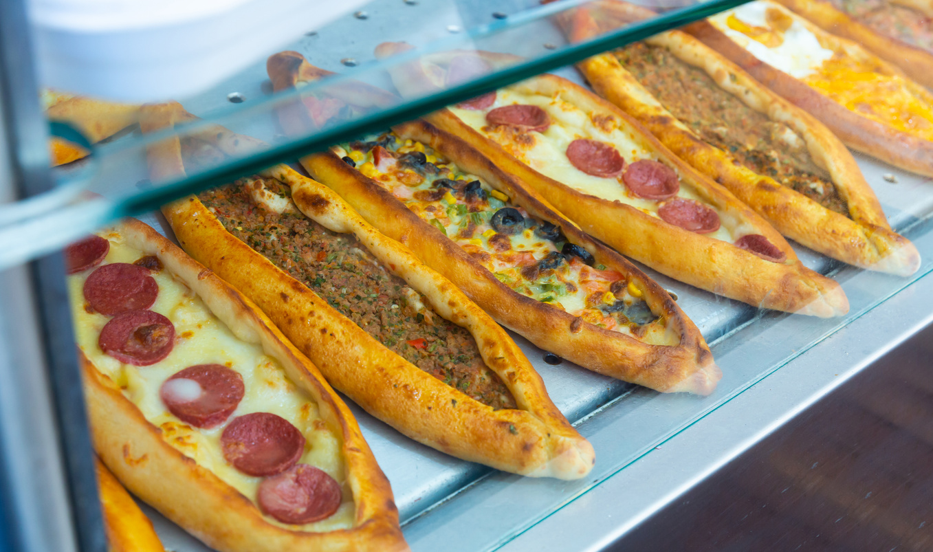 Assorted Turkish foodset. Pide with meat; pide with cheese, pide mix